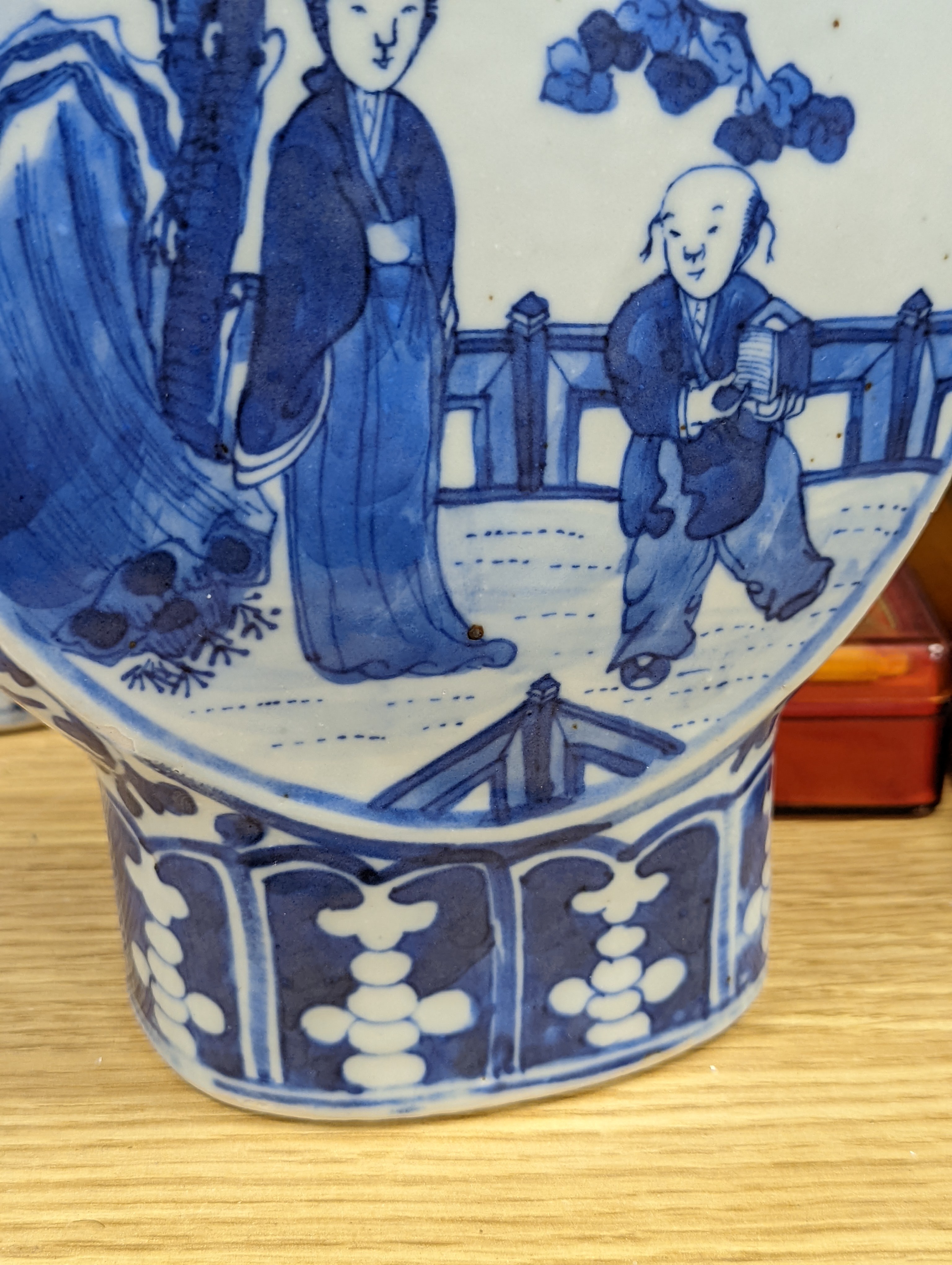 Three 19th century Chinese blue and white Moon flasks, tallest 31 cms.